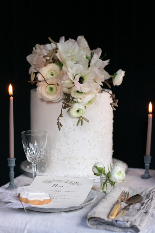Elegant wedding cake with edible lace and pearls