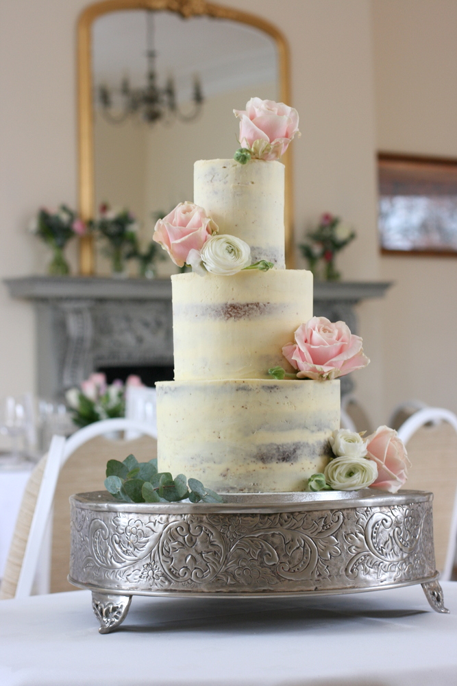 3 tier romantic semi-naked buttercream wedding cake with pink blush roses and ranunculus