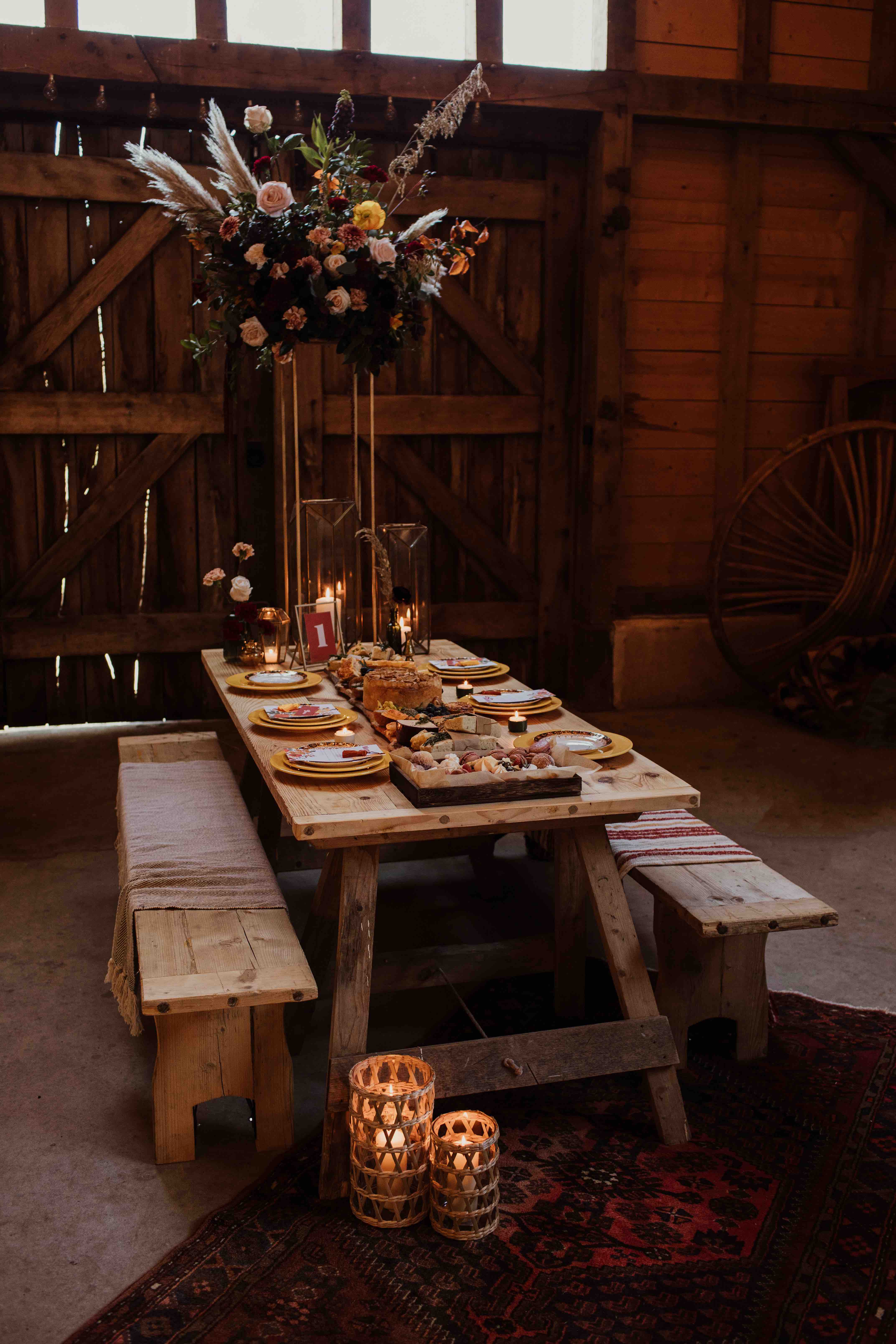 Rustic trestle wedding table scape for a barn wedding