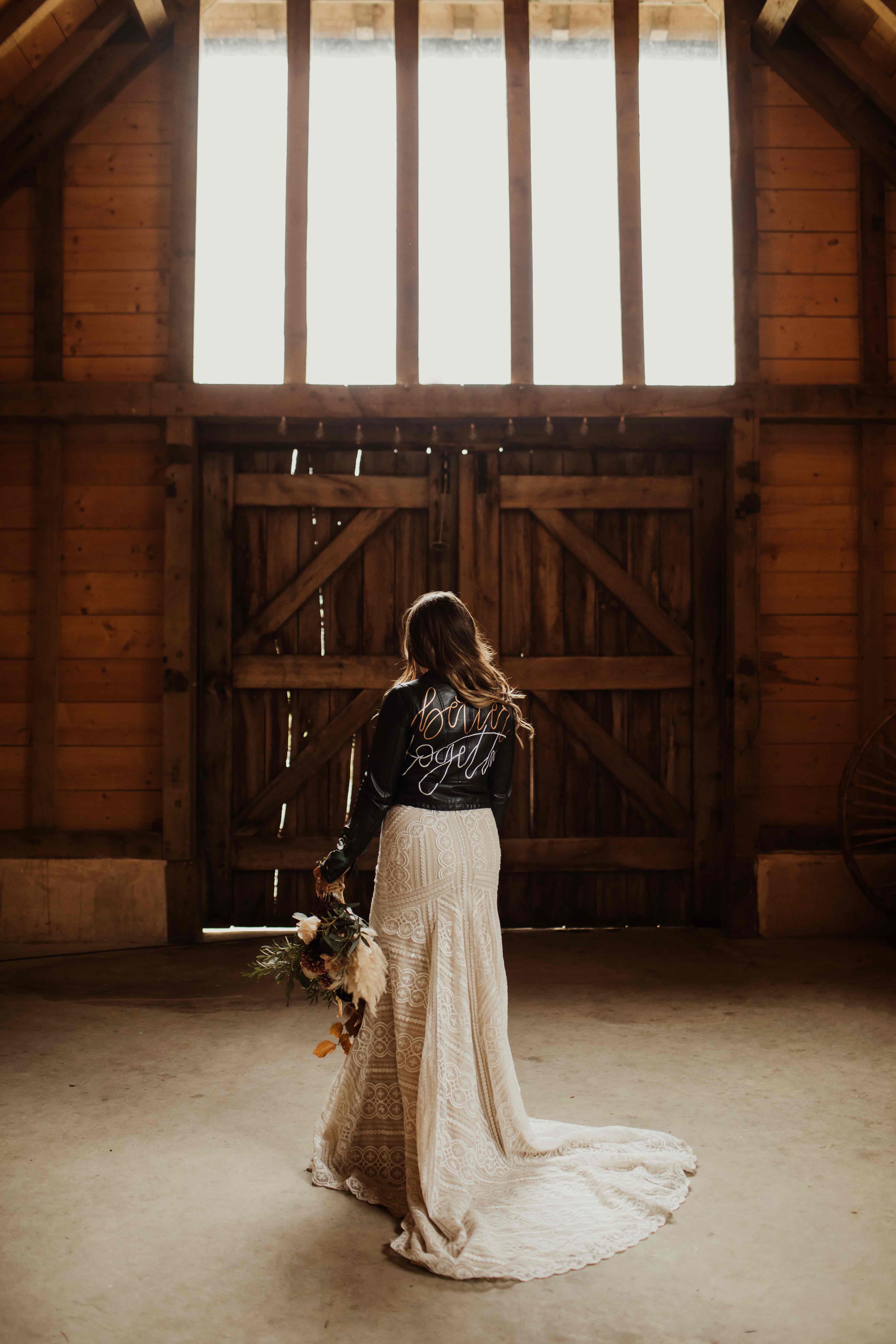 Cool boho bride in leather jacket at The Yoghurt Rooms | barn wedding venue in Sussex