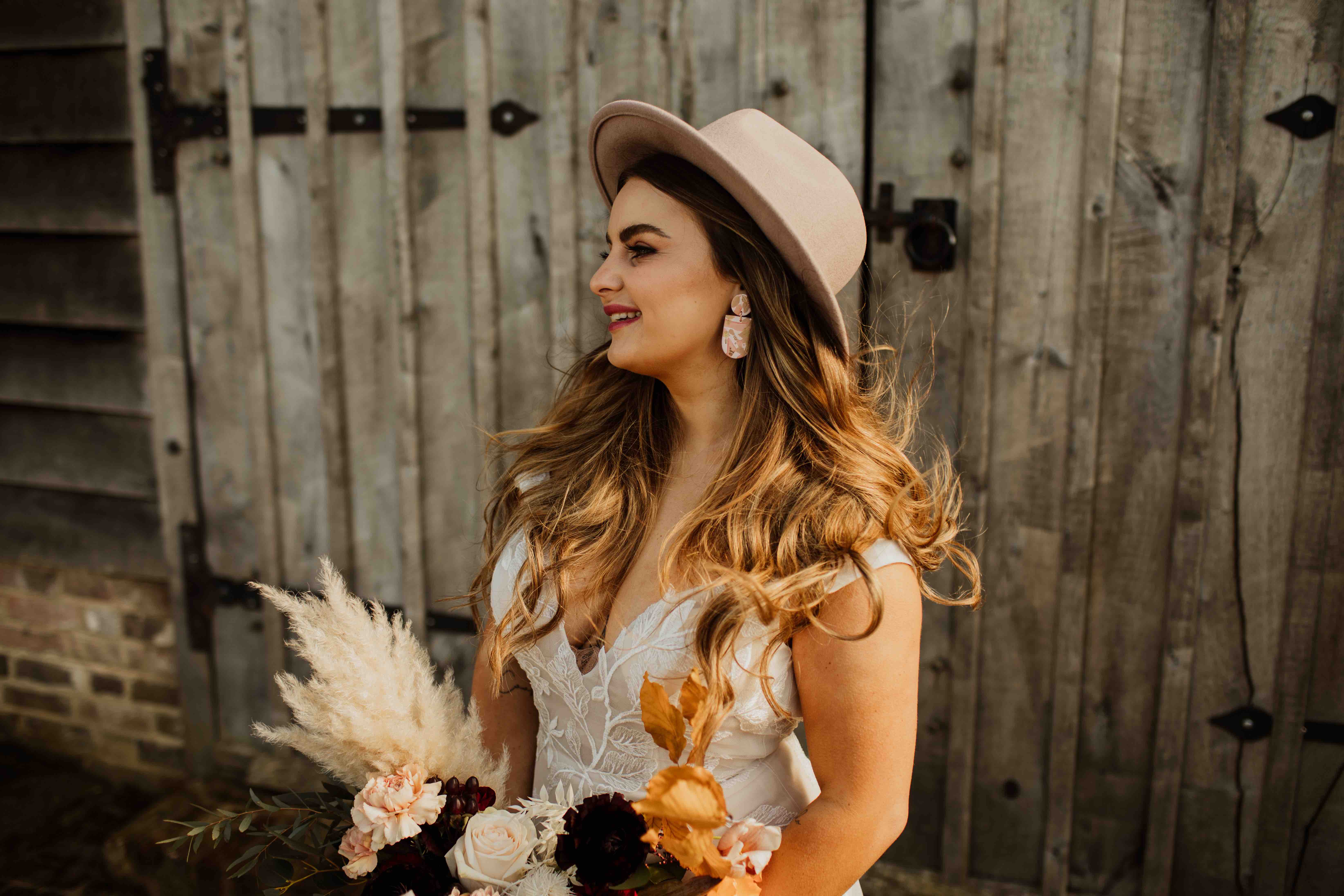  Modern boho bridal look and an extra touch of class with that blush pink hat