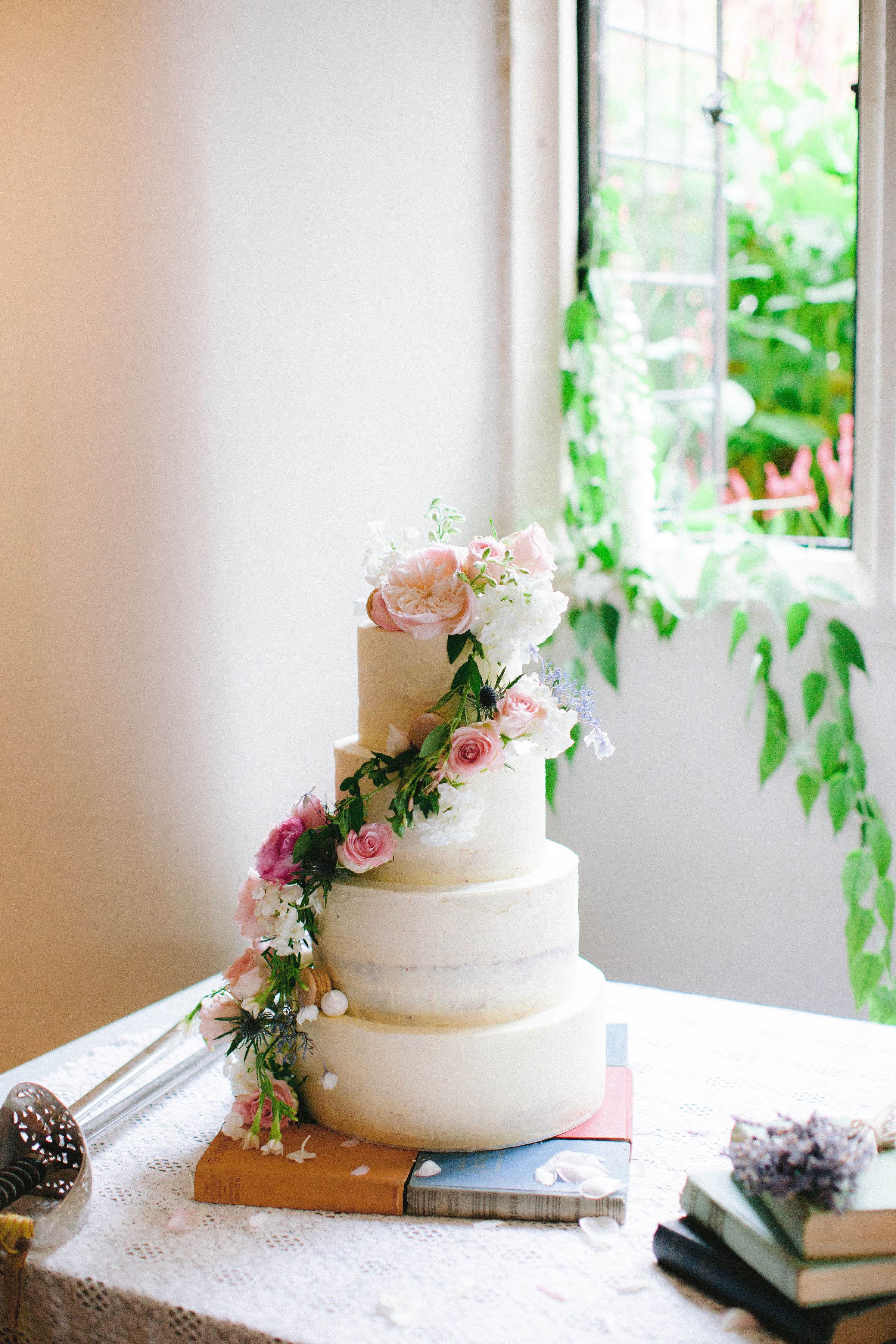 Romantic buttercream wedding cake decorated with English garden flowers | Sugar Plum Bakes