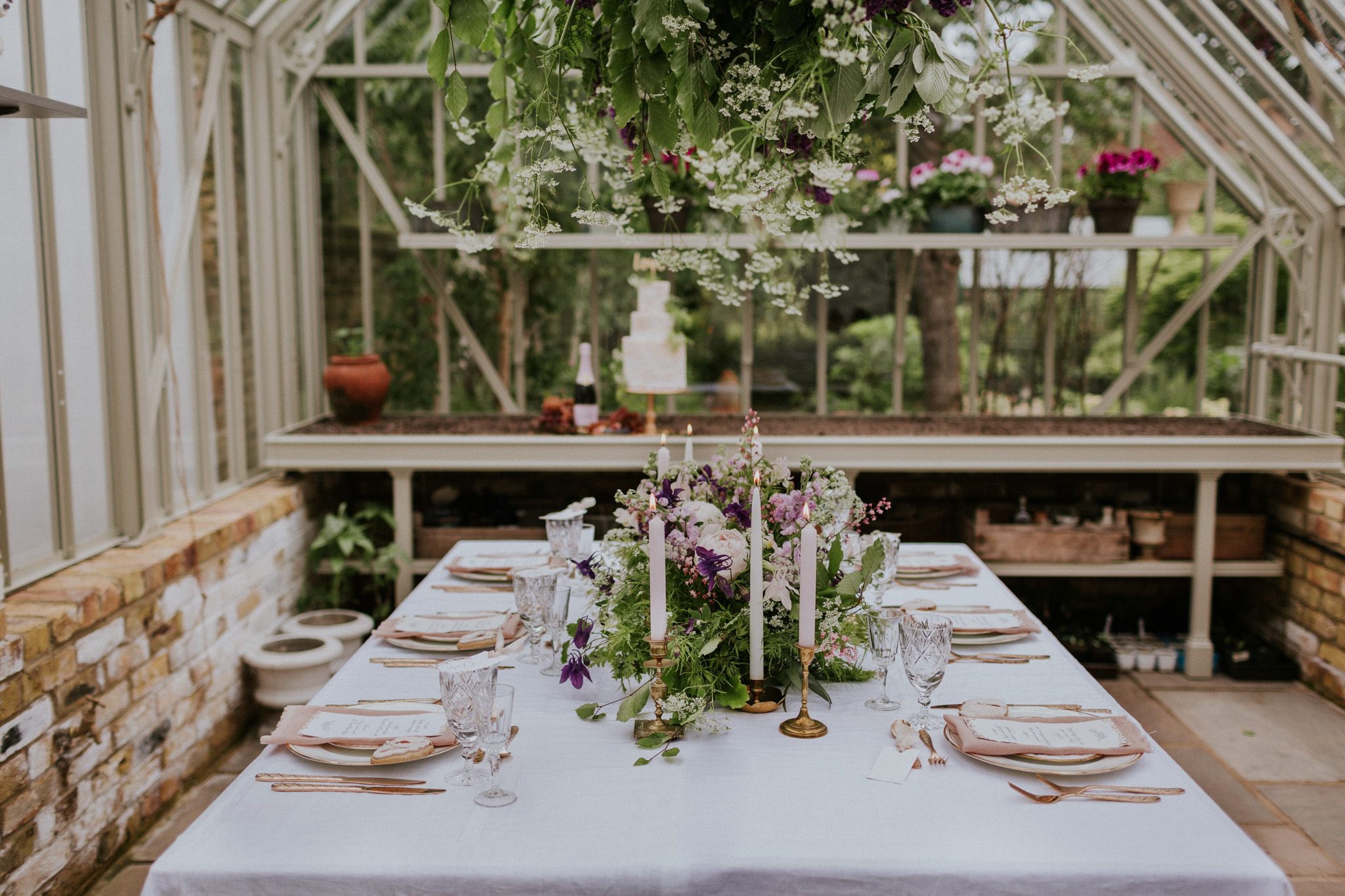 English garden table setting and romantic buttercream wedding cake. Photo by Maja Tsolo