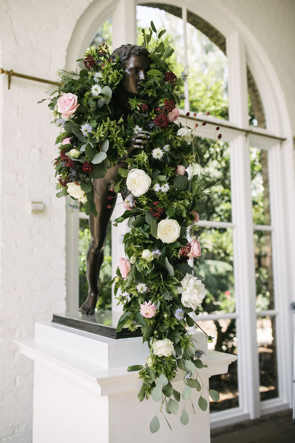 Wedding floral installation at The Orangery, Holland Park. Photo by Kari Bellamy