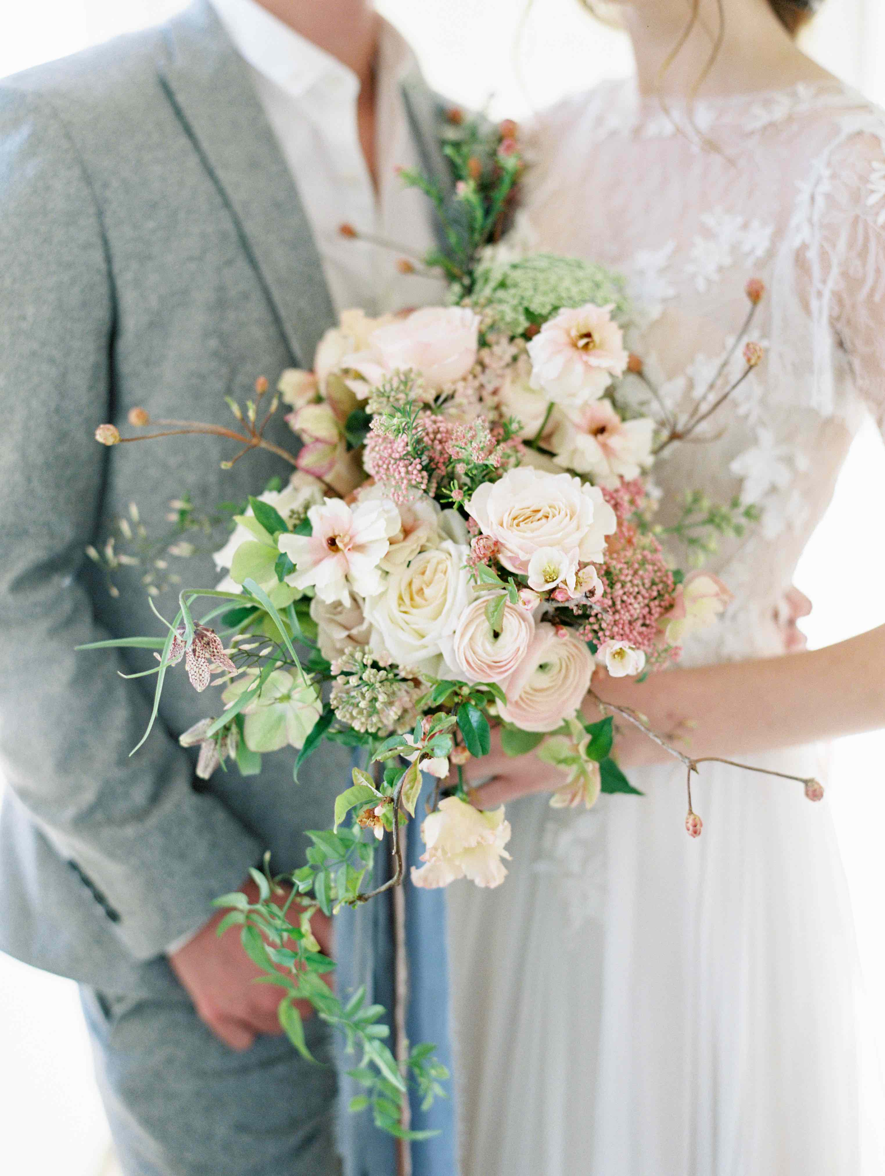 Bridal wedding bouquet in delicate blush pink Spring flowers