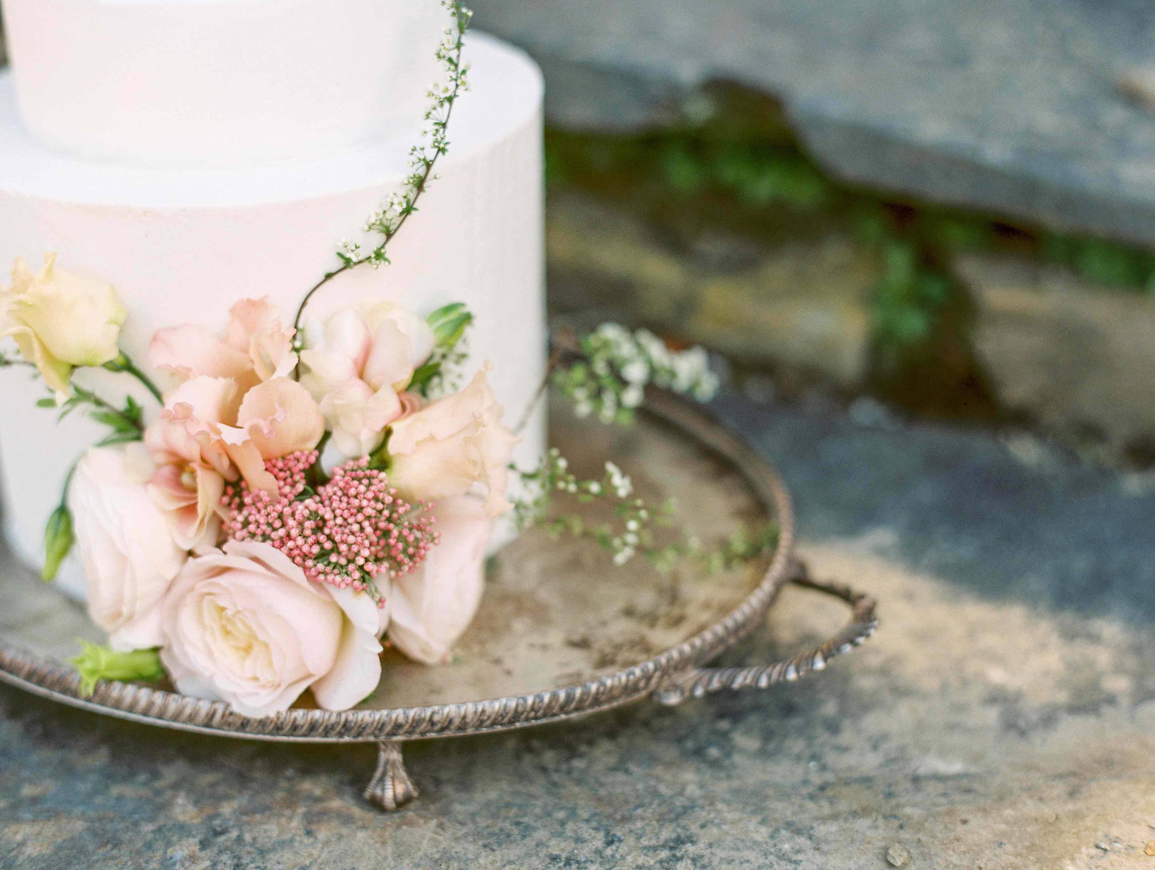 Romantic spring flowers on a buttercream wedding cake
