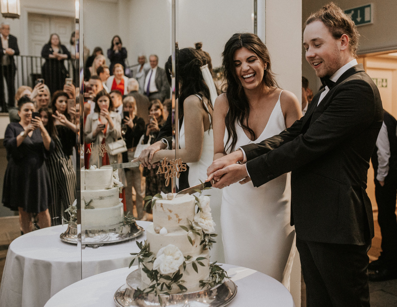 Cake cutting ceremony at Buxted Park Hotel, Sussex. Photo by Nataly J Photography