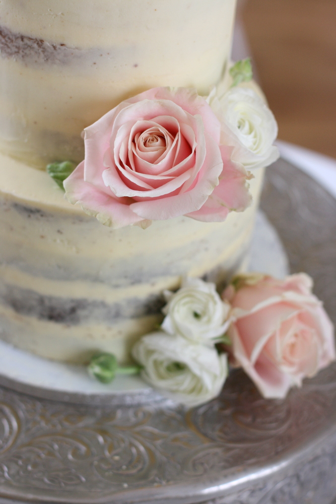 Semi-naked buttercream cake for Spring Pembroke Lodge wedding