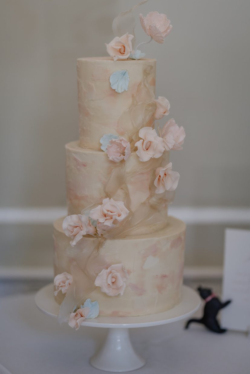 3 tier marbled buttercream wedding cake with pink sugar flowers and rice paper sails | RAC Pall Mall