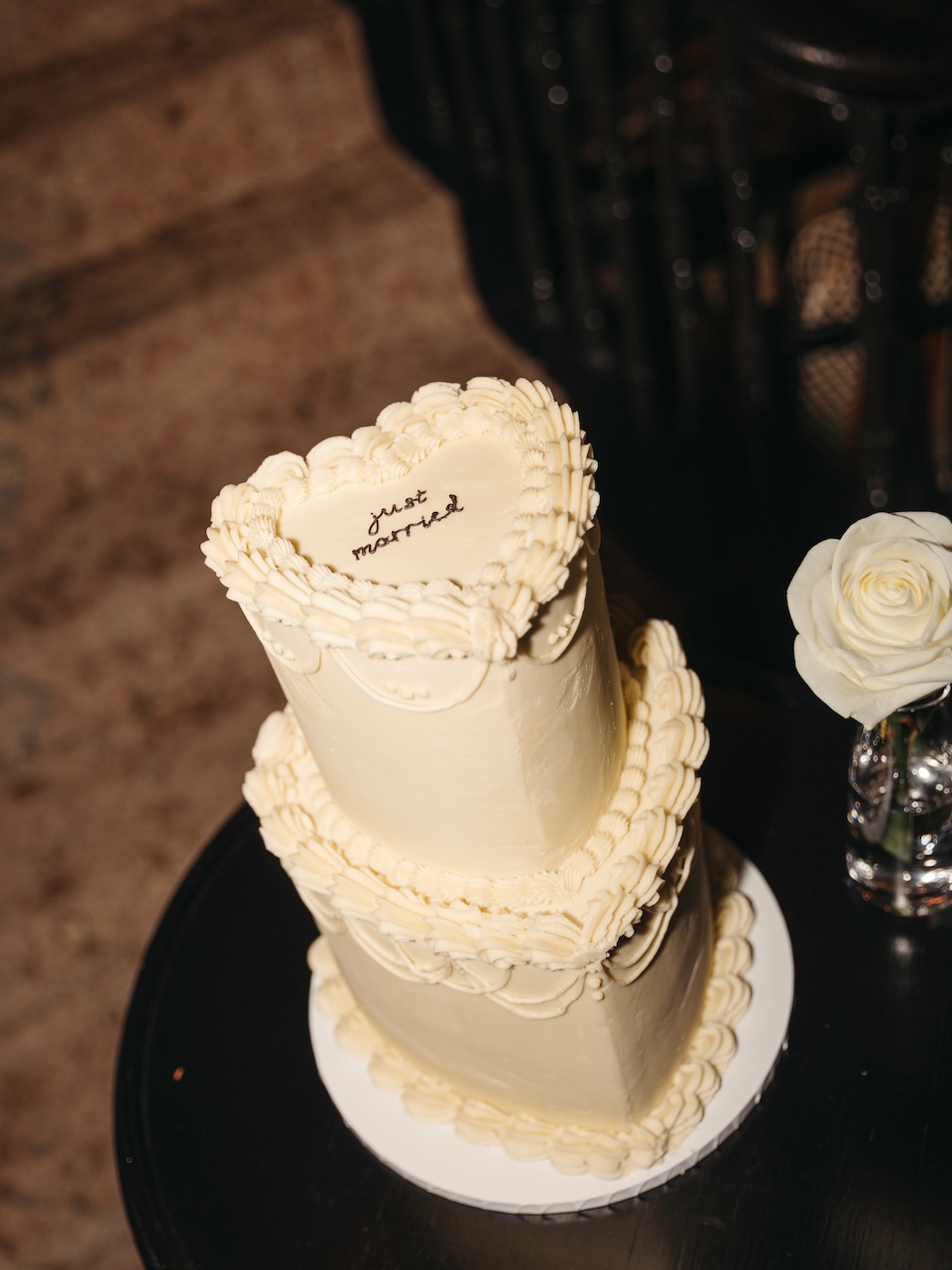 2 tier heart-shaped buttercream wedding cake in lambeth vintage style with piped buttercream