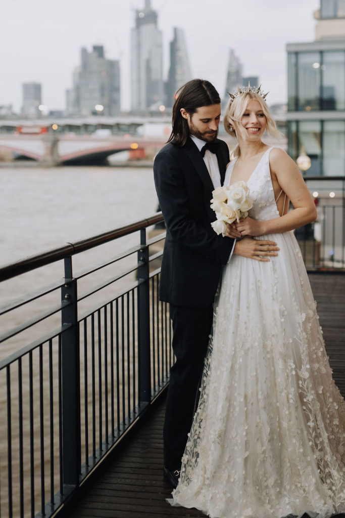Modern contemporary stylish wedding couple against the back drop of London at OXO Tower