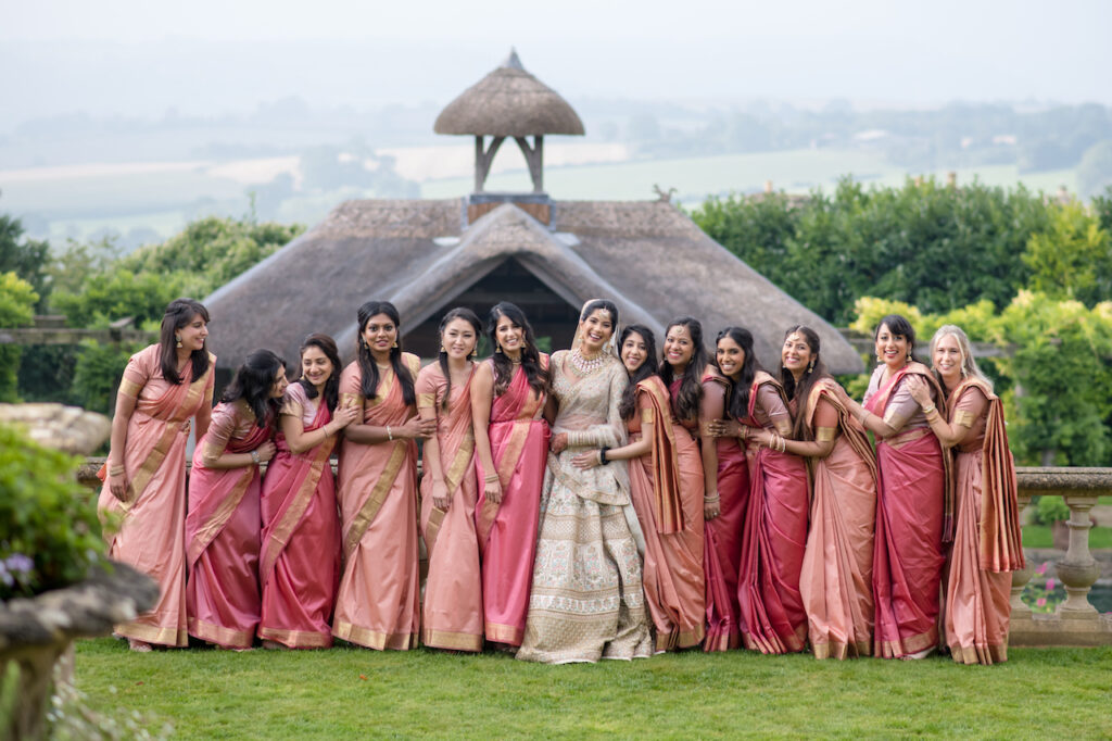 Luxury Asian wedding with bride and her bridesmaids in tradition outfits at Euridge Manor | Cotswolds