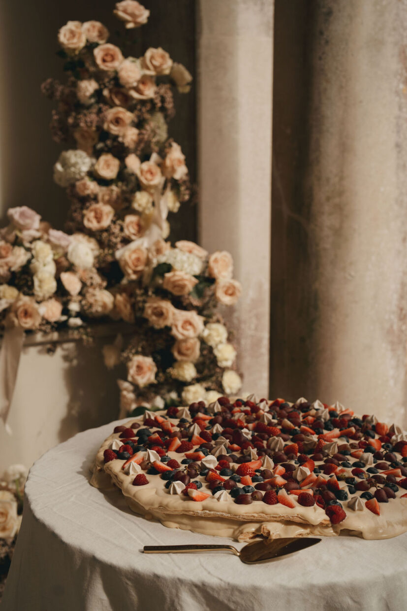 Millefoglie Italian wedding cake decorated with fresh fruit including blueberries, grapes and strawberries | Somerley House | Hampshire wedding UK