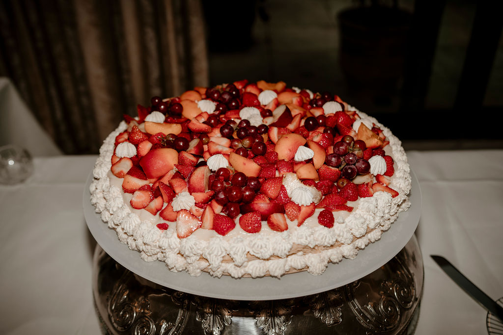 Italian wedding cake decorated with Summer berries and grapes at The Goring Hotel London | The Unbridled Photography