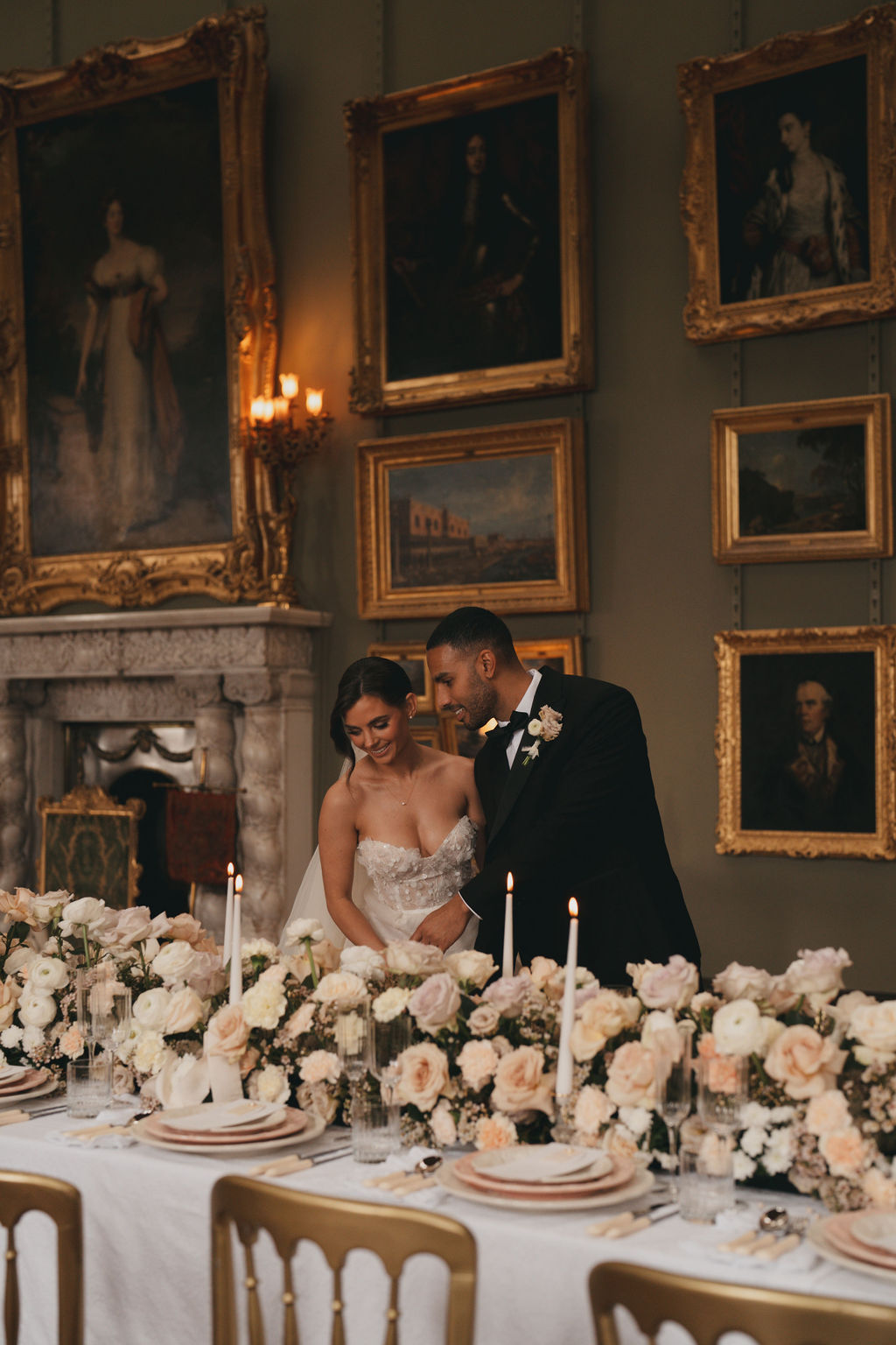 Bride and groom firset look at wedding breakfast decor at Somerley House