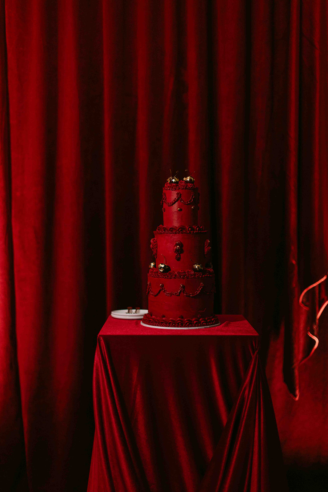 Red velvet draping and red buttercream wedding cake | Philippa Sian Photography | Old Sessions House